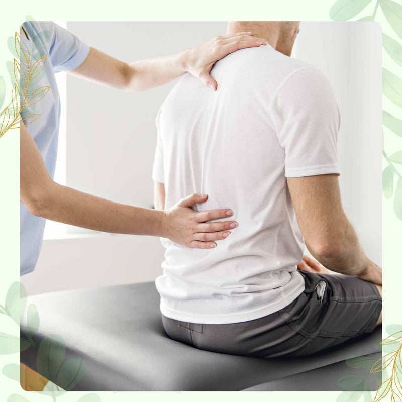 Physical therapist examining and treating a patient's lower back