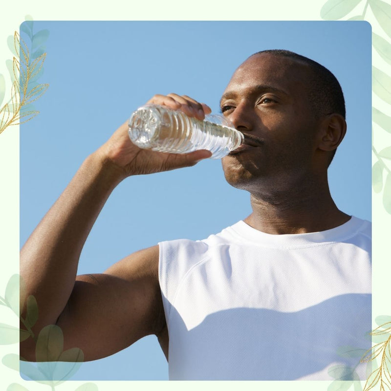 man drinking bottle of water