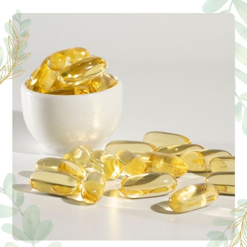 Yellow capsules in a white bowl on a light gray background
