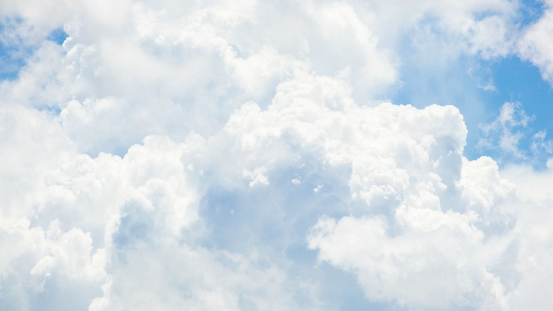 White clouds against a blue sky