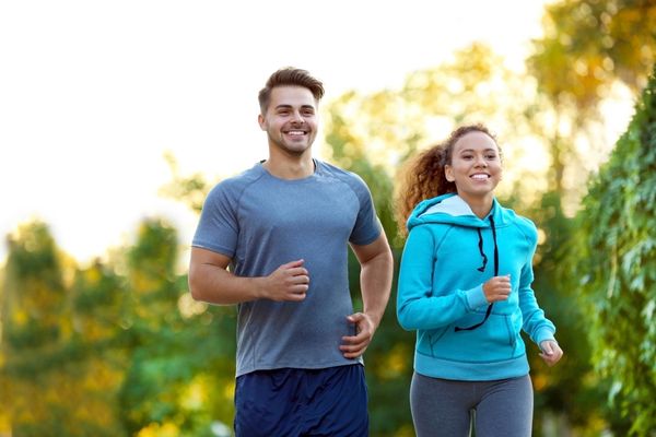 Man and woman running together outdoors